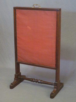 A Victorian mahogany fire screen 22"