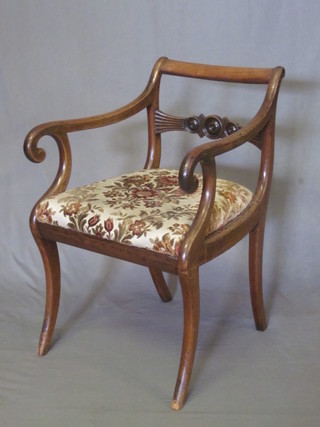 A Georgian bar back desk chair with carved mid rail and woven  rush seat, raised on sabre supports