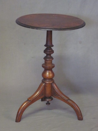 A Victorian figured walnut finished wine table, raised on a turned column and tripod base 18"