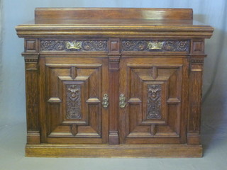 A Victorian carved oak sideboard with raised back, fitted 2  drawers above a double cupboard 55"