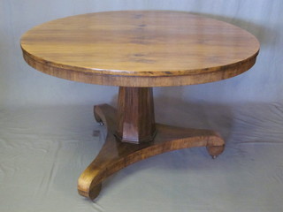 A circular Victorian rosewood snap top breakfast table, raised on  a chamfered column with triform base 47"   ILLUSTRATED