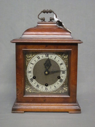 A reproduction Georgian style 8 day striking bracket clock by  Smiths with gilt dial and silvered chapter ring, contained in a  walnut case 9"