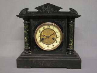An American mantel clock with paper dial and Arabic numerals contained in an ebonised architectural case