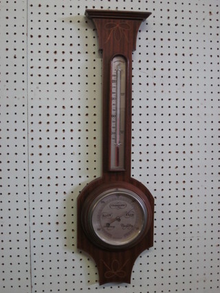 An Edwardian aneroid barometer and thermometer contained in an inlaid mahogany wheel shaped case