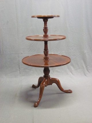 A 19th Century mahogany circular 3 tier dumb waiter, raised on  a pillar and tripod base 26"