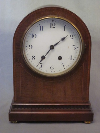 An Edwardian 8 day striking bracket clock with porcelain dial  and Arabic numerals, contained in an arched inlaid mahogany  case