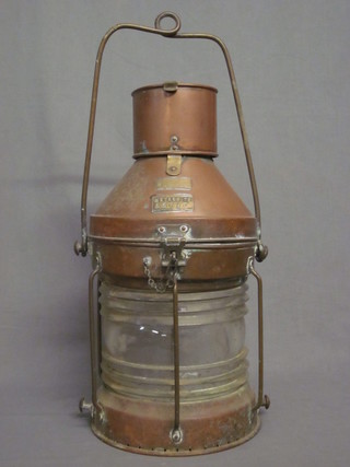 A copper and glass masthead lantern, marked NUC Neterorito  no. 57767