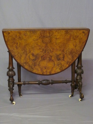 A Victorian oval figured walnut Sutherland table, raised on  turned supports 35"