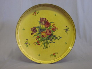 A circular cream and floral painted metal tea tray 17"