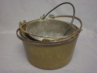 4 circular brass preserving pans with iron swing handles