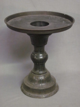 An Oriental circular bronze pedestal stand raised on a column  13"