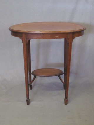 An Edwardian oval inlaid mahogany 2 tier occasional table, raised on square tapering supports ending in spade feet 28"