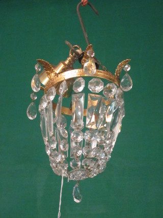 A gilt metal bag shaped electrolier hung lozenges