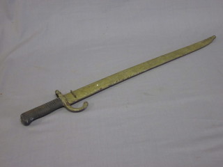 A French chassepot bayonet, the blade dated 1873, complete with metal scabbard