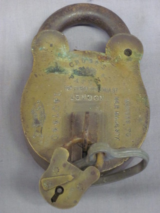 A large brass Chubb patented padlock, marked Chubb Patent 128  Queen Victoria Street, London, no.1407440, complete with key,  3"