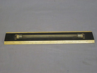 An ebony and ivory rolling ruler, 12", slight chip to back,