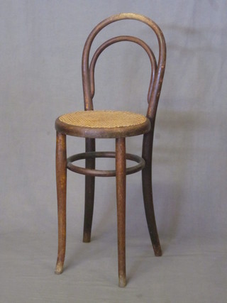 A child's bentwood chair with woven cane seat
