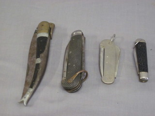 2 multi bladed jack knives and 2 other folding knives
