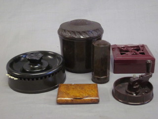 A Bakelite circular match striker/ashtray and other Bakelite items