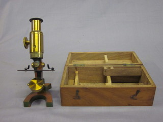 A 19th Century student's brass single pillar microscope, boxed