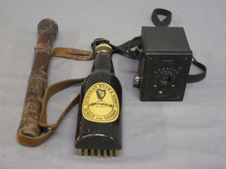 A Guinness advertising clothes brush in the form of a bottle a Guinness, a leather bound priest and a Kodak Hawkeye box  camera