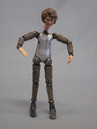 A Swiss metal framed doll with articulated limbs 8"