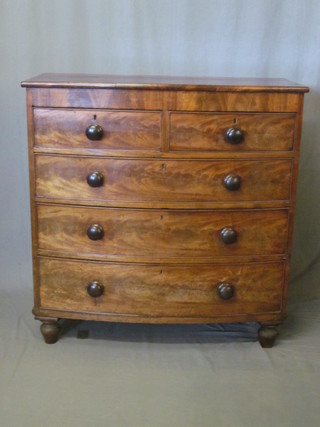 A Victorian mahogany bow front chest of 2 short and 3 long  drawers with tore handles, raised on bun feet 42"