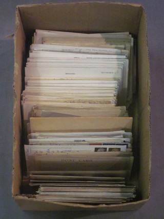 A box of various postcards