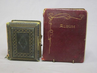 A Victorian leather bound photograph album together with an Edwardian sketch book