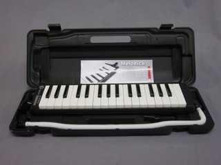 A Hohner Melodica Student 32, cased