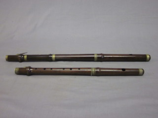 A 2 piece wooden flute and a wooden piccolo marked Church  Lads Brigade