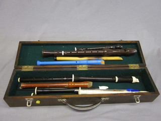 A penny whistle, a plastic flute and 9 recorders