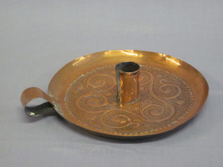A Newlyn style embossed copper chamber stick 7 1/2"