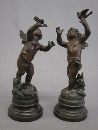A pair of Edwardian spelter figures of cherubs 12"