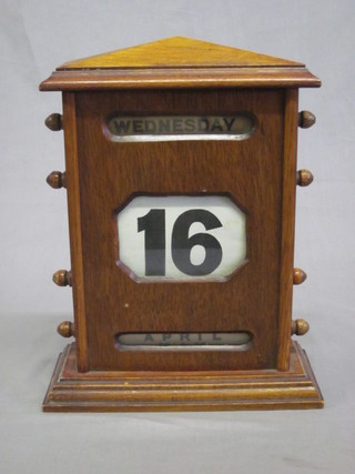 A mahogany cased perpetual calendar