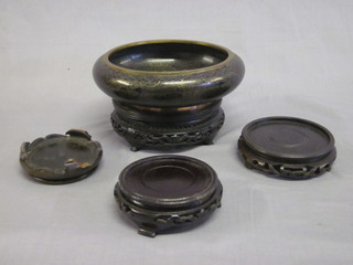 A circular black ground cloisonne enamelled bowl 7", 1 other 5"  and 4 circular hardwood stands