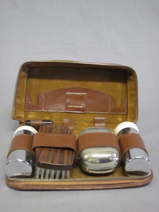 A 1950's gentleman's leather travelling case fitted with  chromium plated fittings