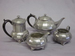 A planished Civic pewter 4 piece tea service comprising teapot, hotwater jug, cream jug and sugar bowl
