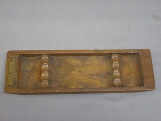A rectangular pen tray made from teak from HMS Iron Duke 9"