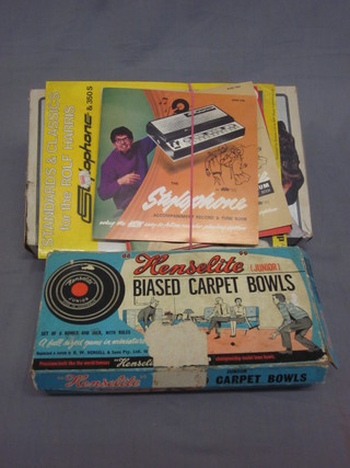 A Rolf Harris Stylophone together with a set of Henselite carpet  bowls