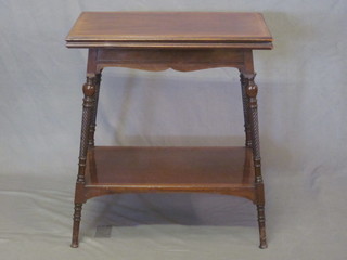 An Edwardian rectangular mahogany 2 tier tea table raised on  turned supports 22"
