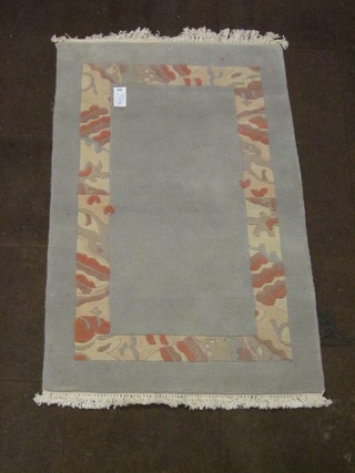 A grey ground Tibetan rug 59" x 37"