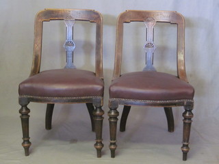 A set of 6 Victorian bar back dining chairs with shaped slat backs  and upholstered seats, raised on turned and reeded supports