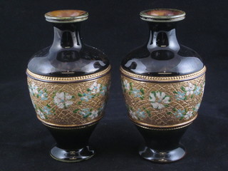 A pair of Doulton green glazed vases 5 1/2"