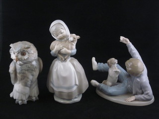 A Nao figure of a seated boy with dog 7", hand f, ditto figure of  an owl 7" and 1 other girl with lamb 9"