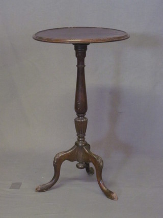 A circular mahogany wine table 17"