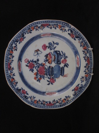 An Oriental porcelain plate decorated an urn and table 9"