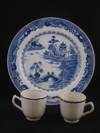 An Oriental blue and white porcelain plate decorated Willow pattern, cracked, 10" and 2 Oriental porcelain cups
