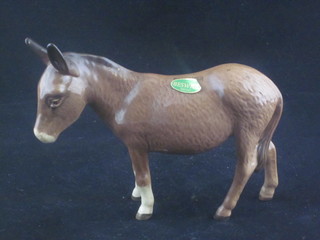 A Beswick figure of a standing donkey, 3"
