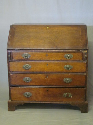 An 18th/19th Century oak bureau, the fall front revealing a well  fitted interior above 4 long drawers, raised on bracket feet 36"
